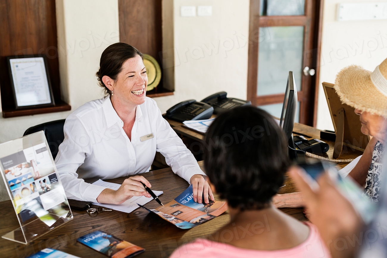 Resort Receptionist Speaking Guest Premium Photo Rawpixel