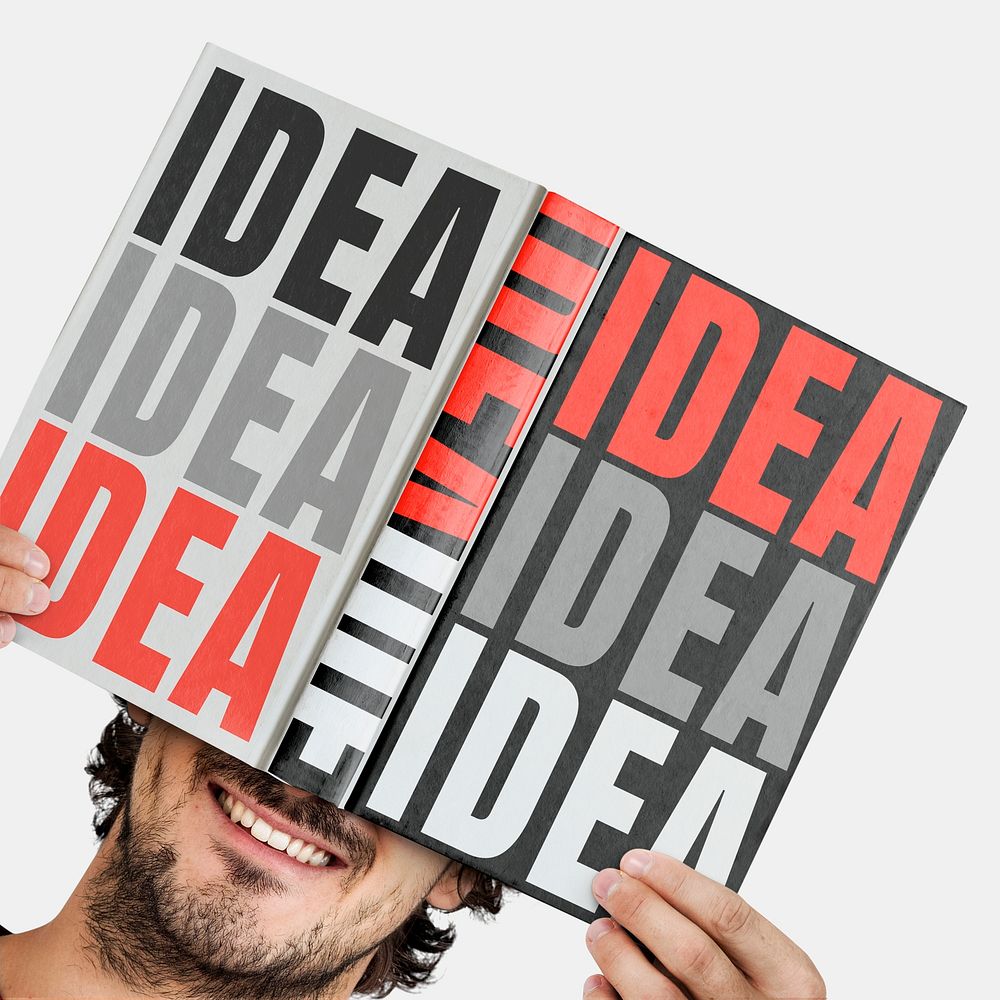 Man holding abstract hardcover book Free Photo rawpixel