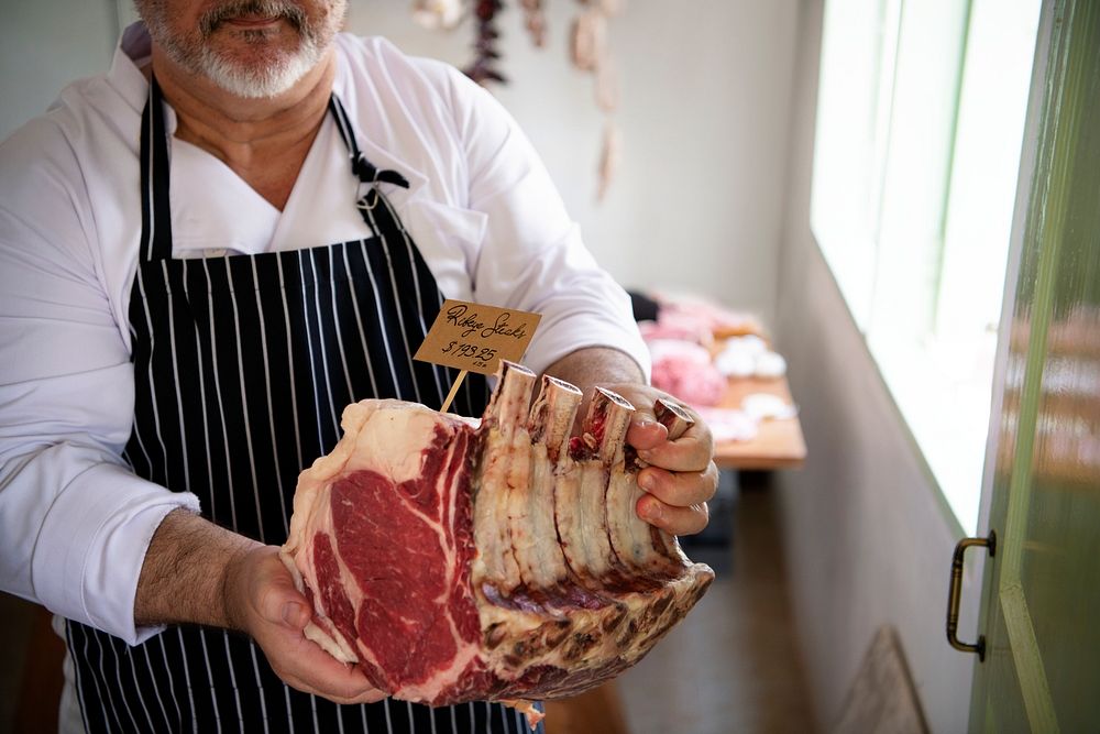 Butcher Selling Meat In A Butcher Photo Rawpixel