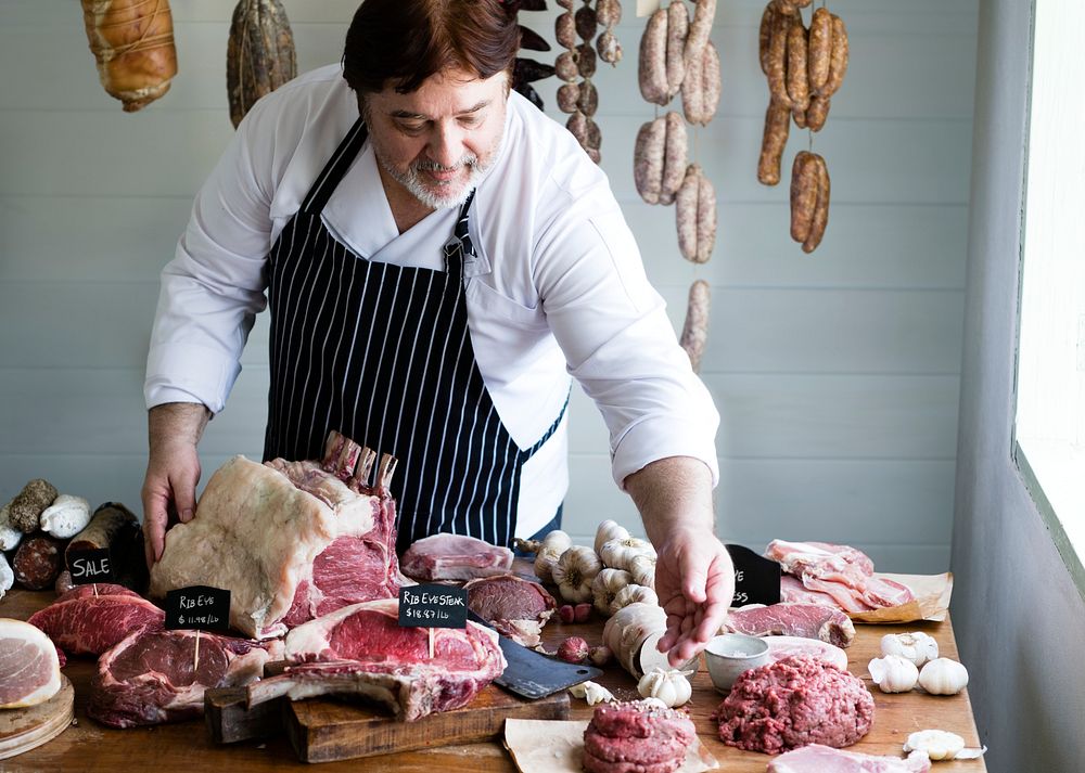 Butcher Selling Meat In A Butcher Photo Rawpixel