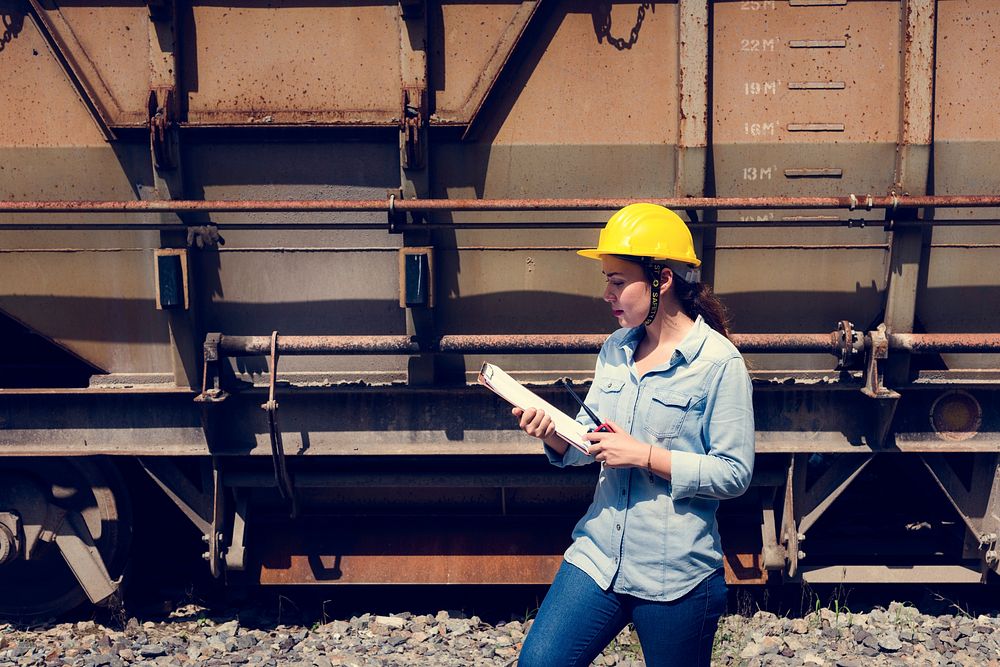 Female inspector at railroad tracks Premium Photo rawpixel