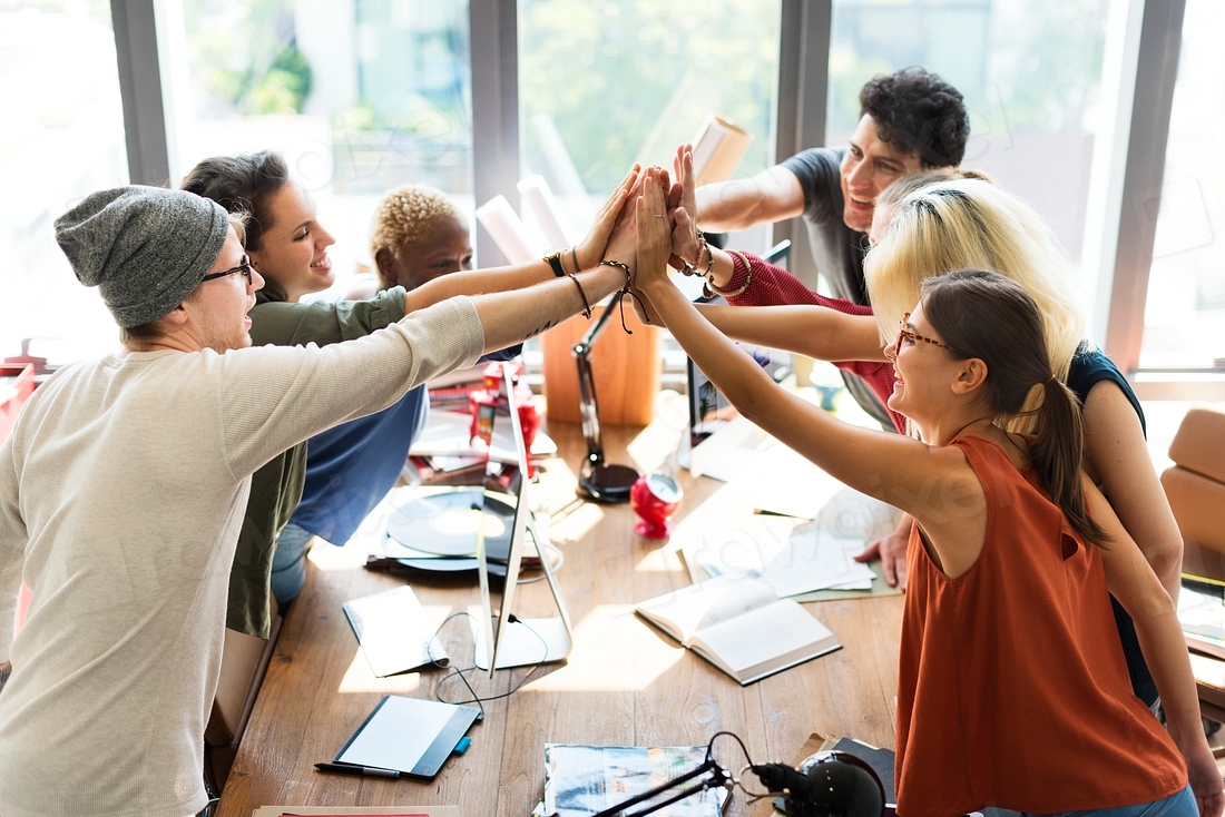 Colleagues put hands together | Premium Photo - rawpixel