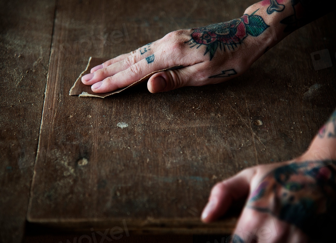 Hands with tattoo using sandpaper Premium Photo rawpixel