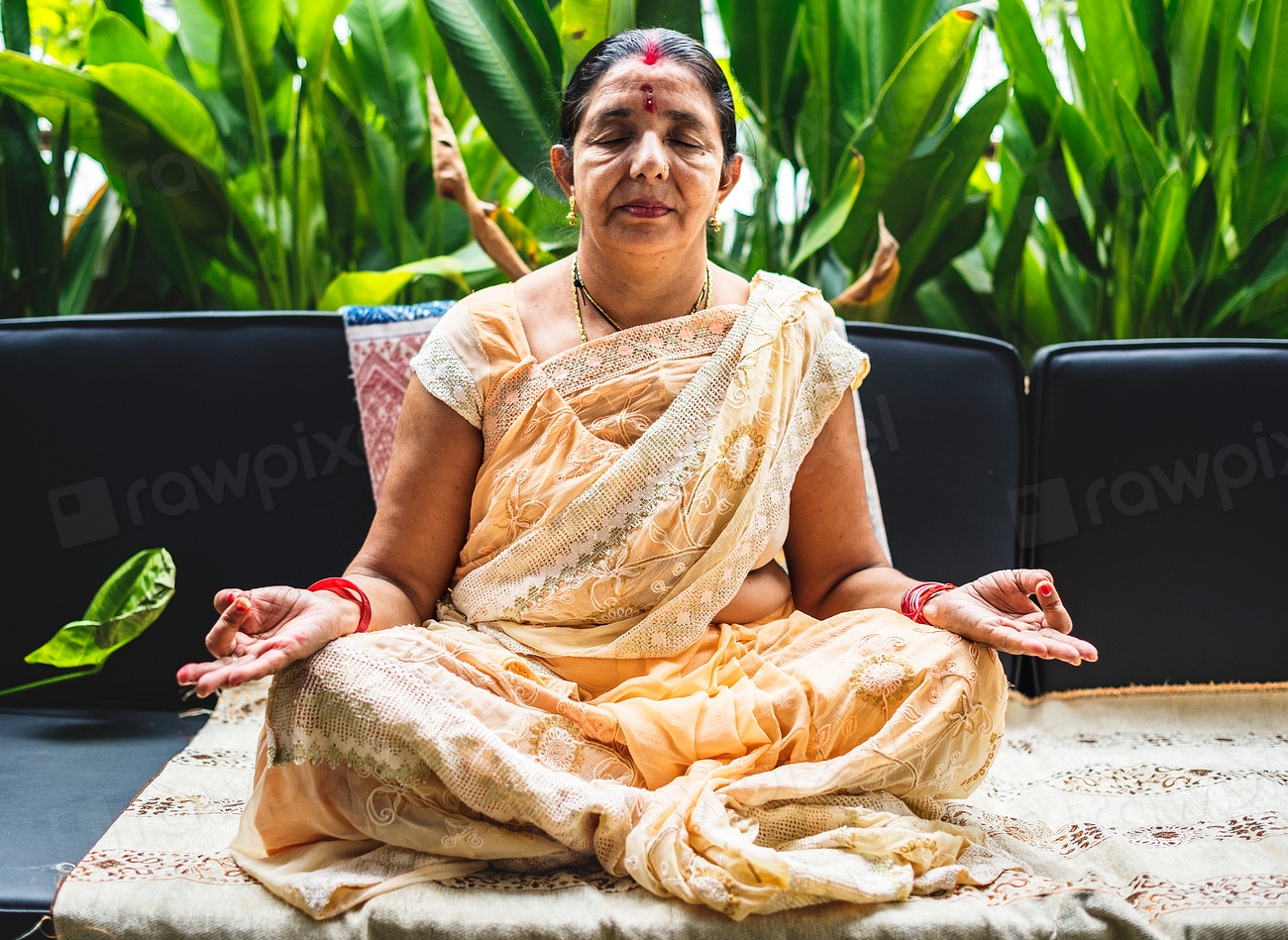 A meditating Indian woman Premium Photo rawpixel