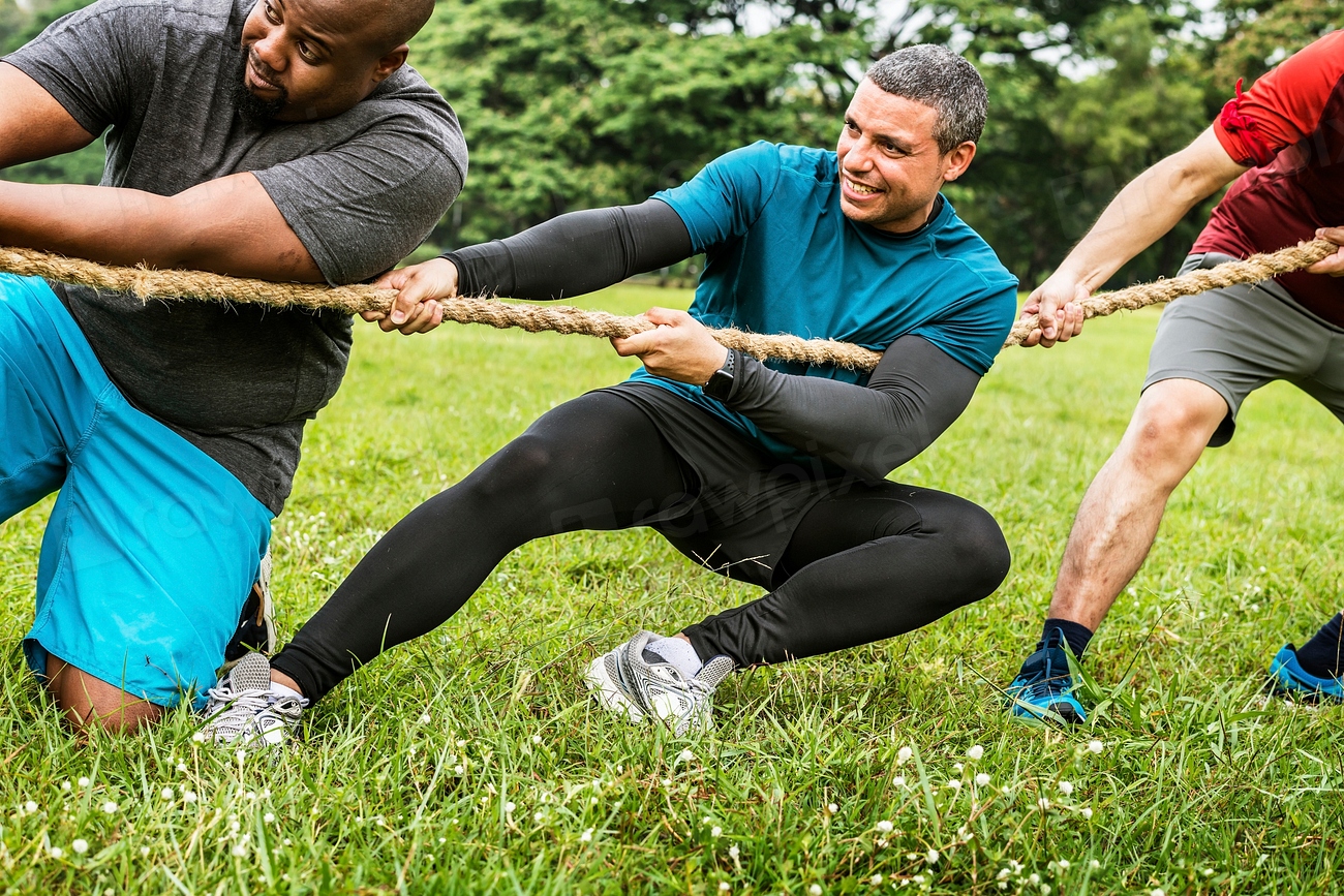 Team competing in tug of war Premium Photo rawpixel