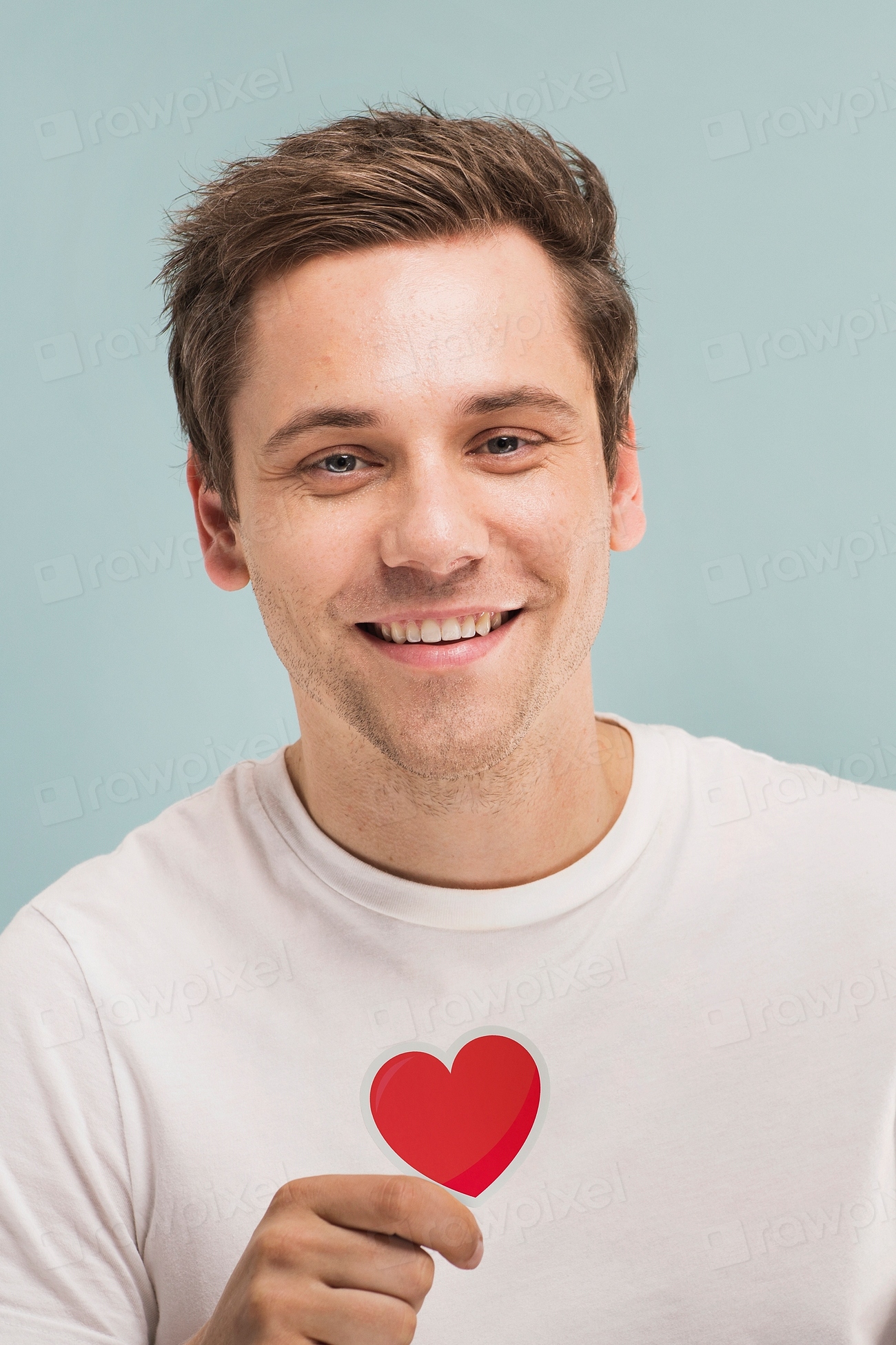 cheerful-man-holding-a-heart-photo-rawpixel