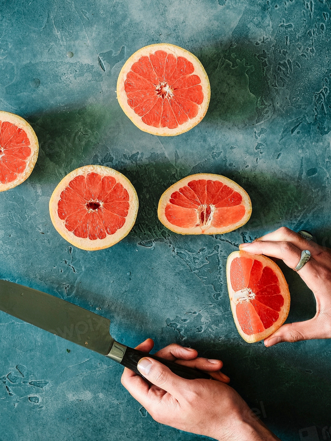Preparing grapefruit for dessert Free Photo rawpixel
