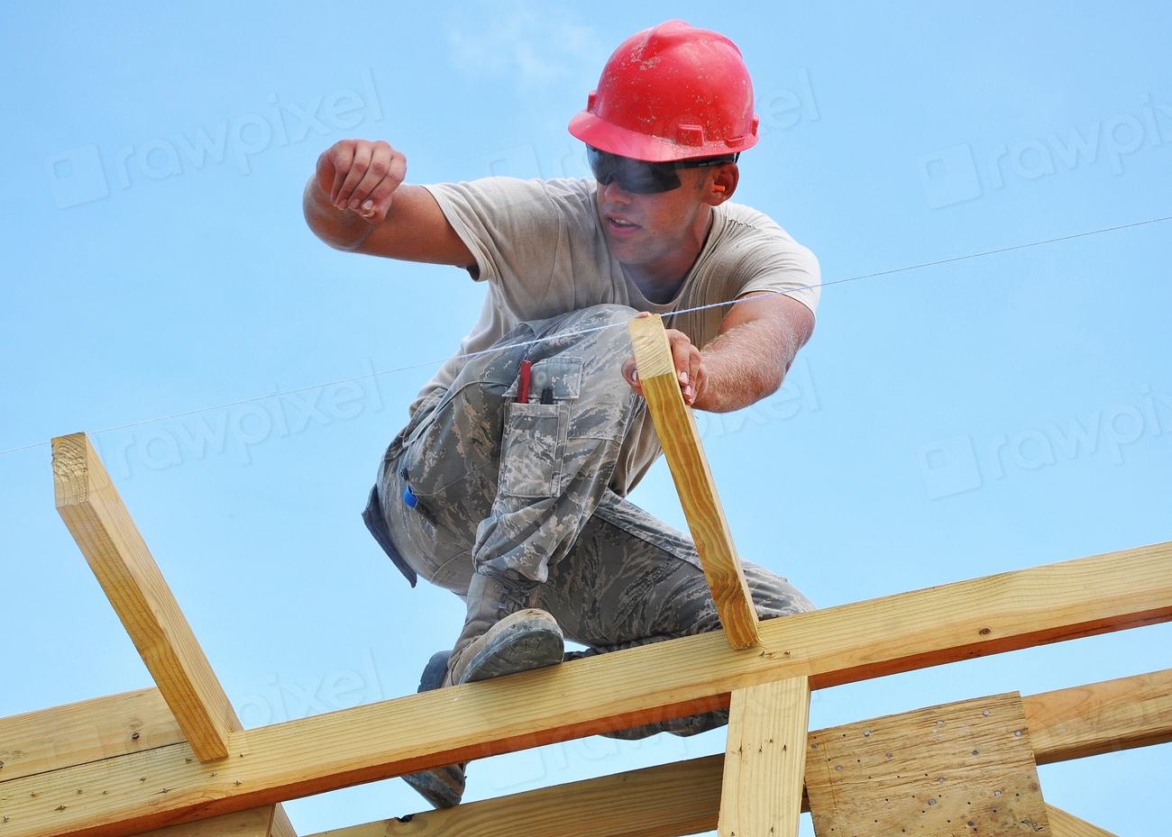 Construction worker wearing a hard hat on a construction site.