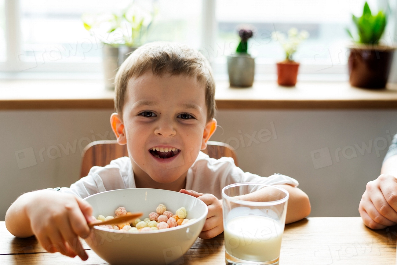Little boy eating breakfast | Free Photo - rawpixel