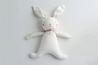 Fabric rabbit toy outdoors snowman person.