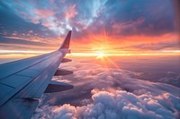 Beautiful sunset sky above clouds airplane transportation outdoors.