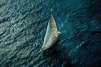 Aerial view of a sailboat in open seas transportation recreation vehicle.