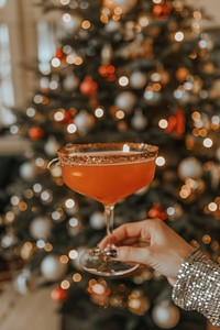 A pink cocktail glass christmas beverage.