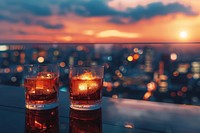 Cocktail glasses with city view cocktail beverage outdoors.