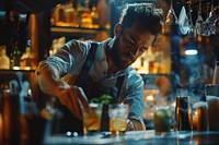 Expert barman is making cocktail at night club person adult human.