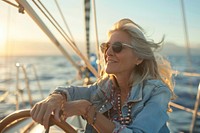 Woman sitting on a yacht bow female transportation photography.