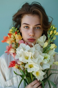 Woman with beautiful bouquet of freesia flowers photo photography portrait.