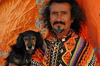 Hispanic man holding dog portrait photography clothing.