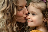 Happy Mother Kissing daughter Cheek photography kissing happy.