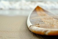 Photo of Surfboard In Sand surfboard recreation outdoors.