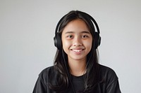 Teenage Filipino wearing wireless headphone headphones portrait photo.