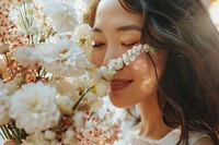 Cheerful asian woman smell a big flower buquet in hand photo photography smelling.