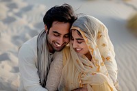 Pakistani couple hugging together bridegroom clothing wedding.