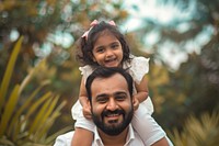 Pakistani dad carrying little daughter photo photography portrait.