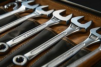 Set of metric combination wrenches neatly organized weaponry blade razor.