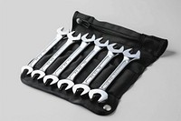 Set of metric combination wrenches neatly organized weaponry dagger device.