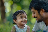 Indian kid playing with father in the park happy photo photography.