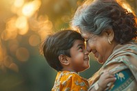 Indian kid playing with grand mother in the park photo happy photography.
