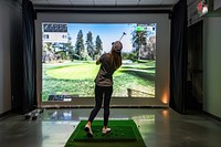 Golf simulator female transportation golf course.