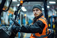 Worker driving forklift worker transportation vehicle.