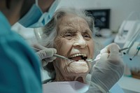 Checking teeth of old woman sitting on dentist chair architecture toothbrush clothing.