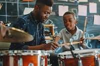Teacher teaching boy playing drums at music classroom recreation microphone performer.