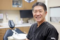 A asian man dentist smile aganist dental person adult human.
