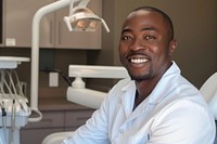 A black man dentist smile aganist dental person adult human.