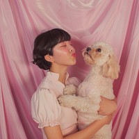 Asian short hair girl having fun pose with dog in photobooth snap shot photography portrait clothing.