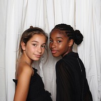 French girl and black girl crazy pose in photobooth snap shot photography portrait clothing.