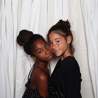 French girl and black girl crazy pose in photobooth snap shot photography portrait person.