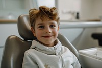 Kid smile sitting on dentist chair photo photography portrait.