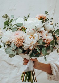 A photo of an eucalyptus and pink peony flower bouquet rose graphics blossom.