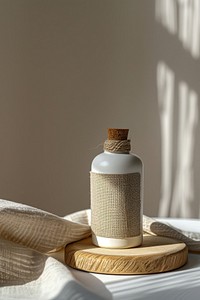 Craft plain package cosmetic bottle with fabric label mockup cushion indoors pillow.