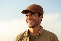 A man wearing a brown cap happy photo face.