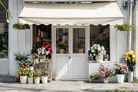 A front view of a minimal cozy modern and elegant flower shop awning architecture building.