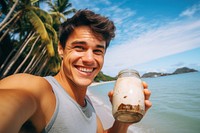 Young man drinking coconut water selfie beverage dimples.