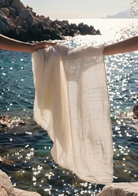 White beach towel beachwear clothing apparel.