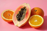 A papaya cut in half orange fruit produce.