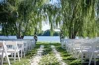 Outdoor wedding ceremony outdoors chair tree.